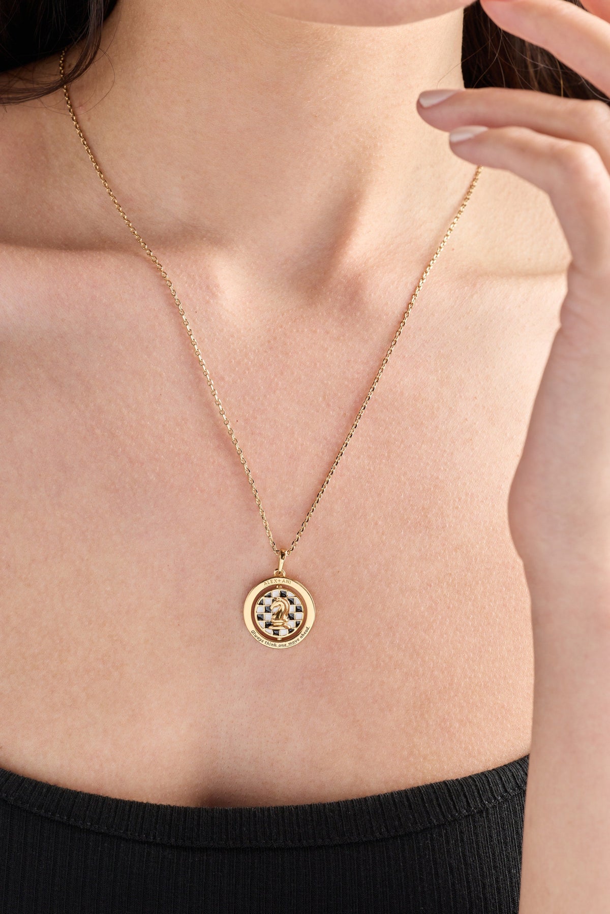 Gold chess spinner pendant necklace with round crystal halo and checkered chess center