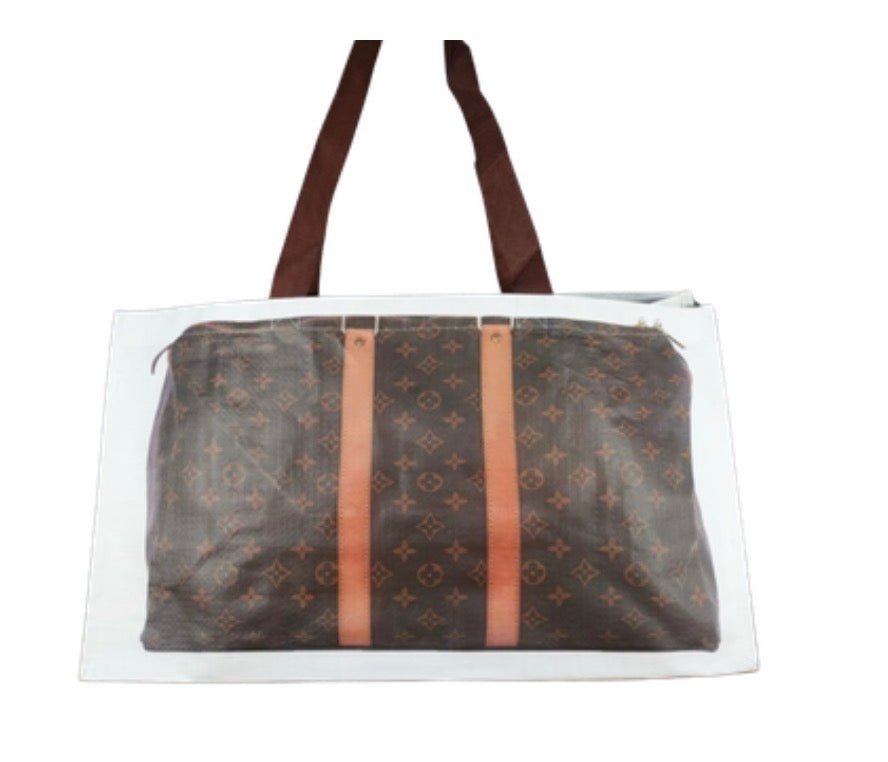 Reusable tote bag with dark brown patterned front panel and tan vertical straps