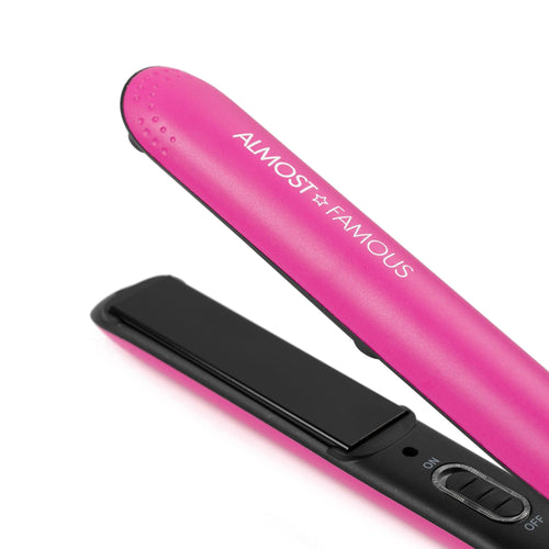 Pink flat iron with black heating plates, side control buttons visible