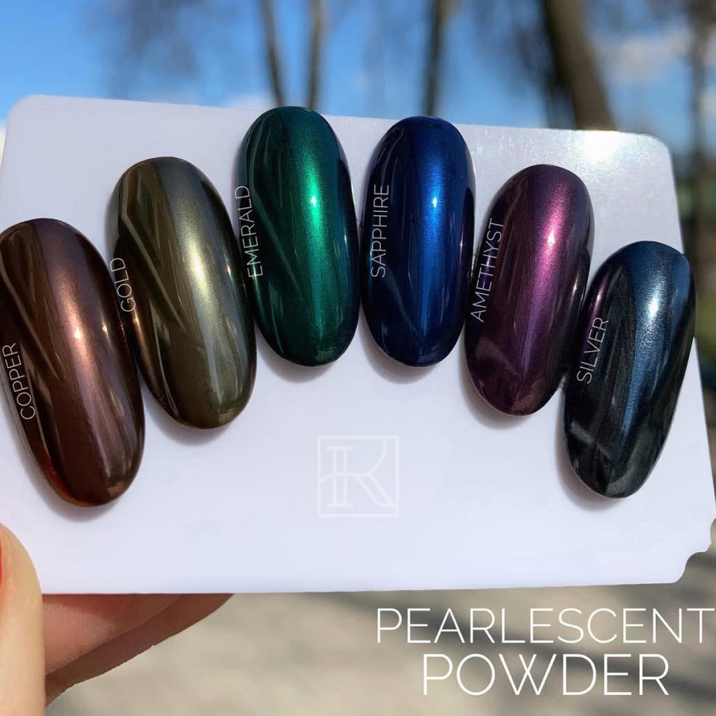 Silver pearlescent gel-play nail swatch on a display card, other shades shown