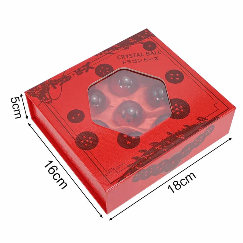 Red gift box with clear window showing seven resin crystal globe spheres inside