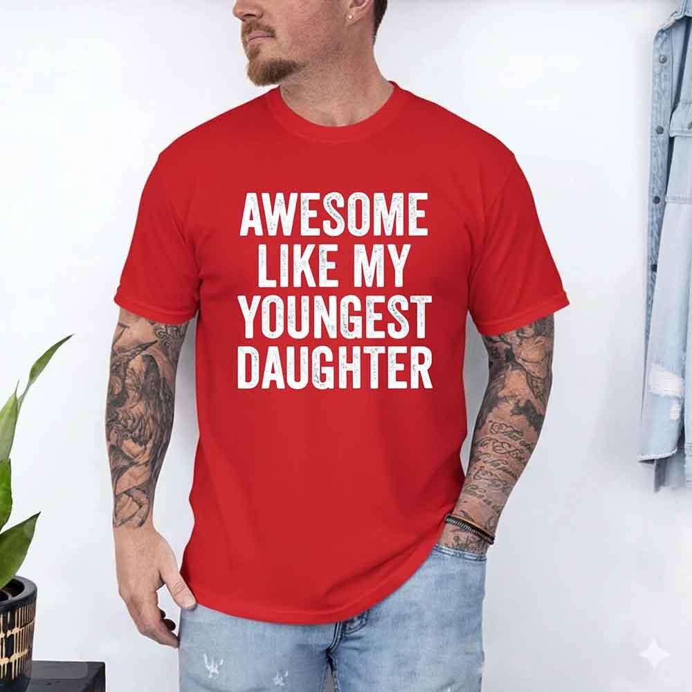 Red adult graphic T-shirt with bold white "AWESOME LIKE MY YOUNGEST DAUGHTER" text