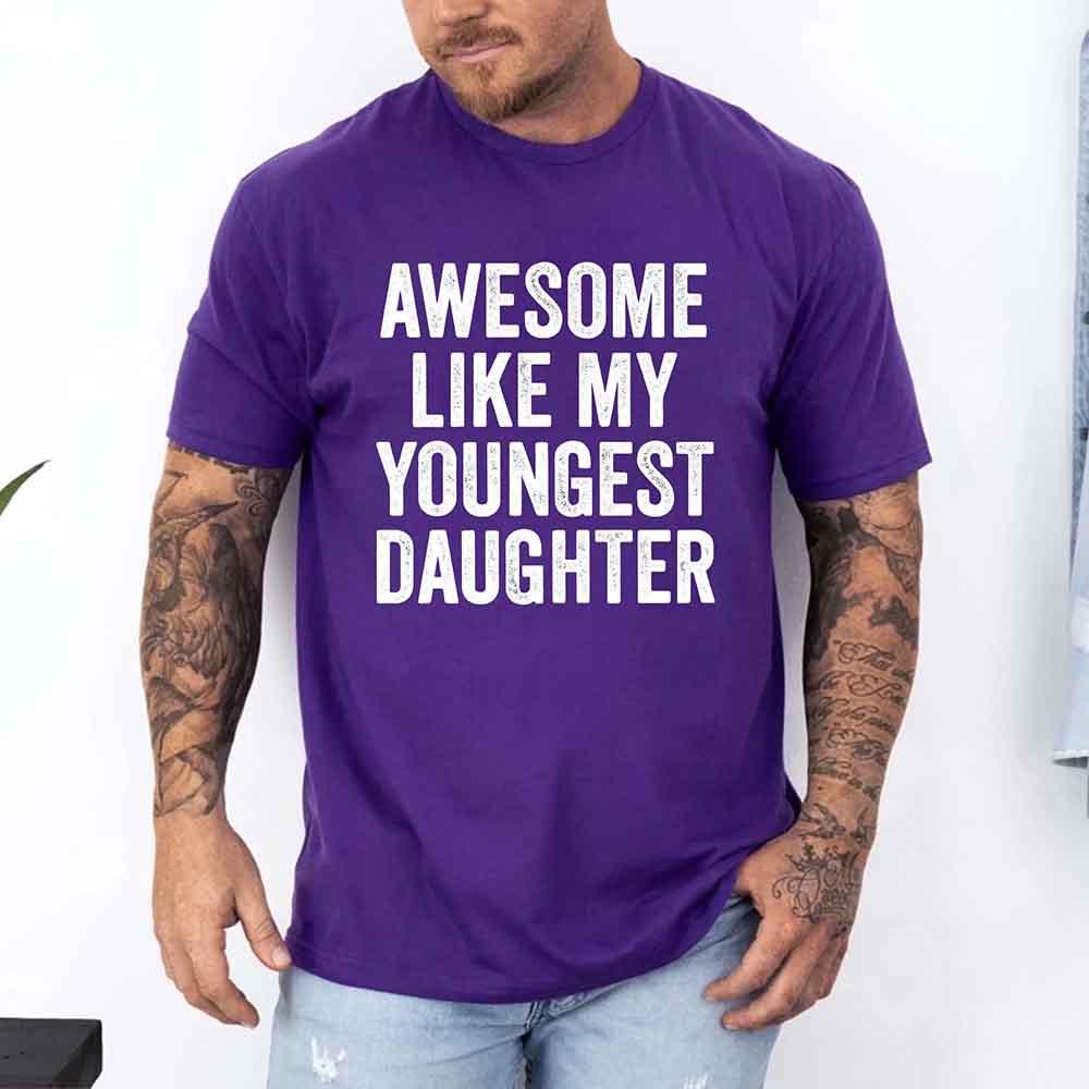 Purple adult graphic T-shirt with bold white "AWESOME LIKE MY YOUNGEST DAUGHTER" text