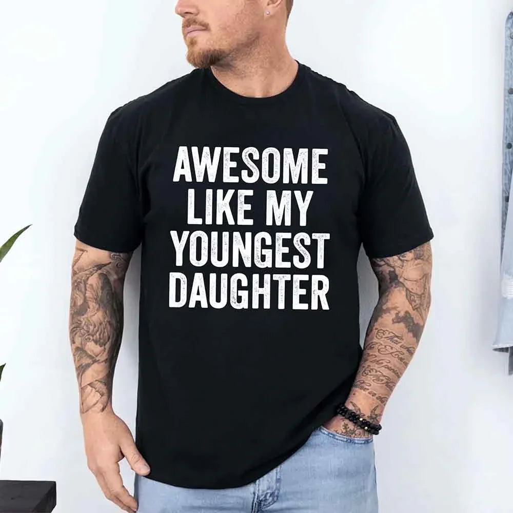 Black adult graphic T-shirt with bold white "AWESOME LIKE MY YOUNGEST DAUGHTER" text