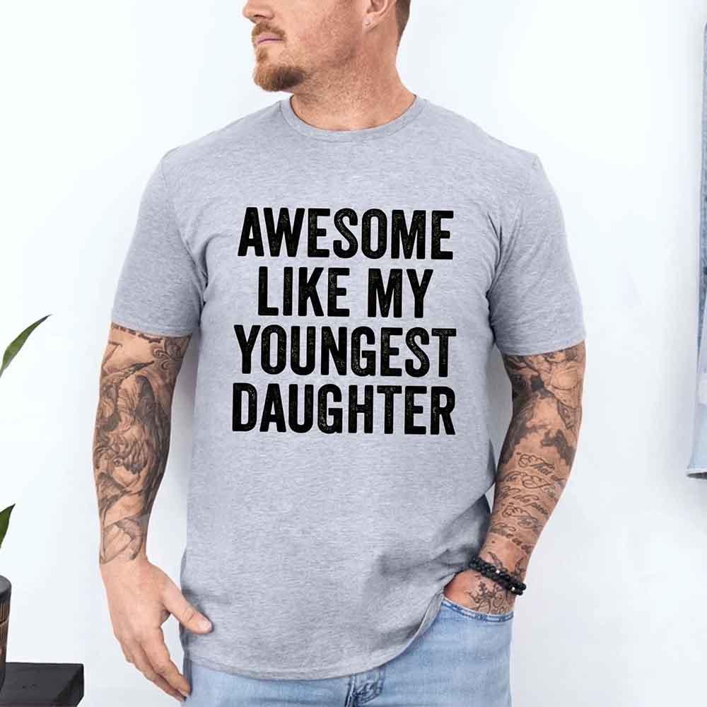 Grey adult graphic T-shirt with bold black "AWESOME LIKE MY YOUNGEST DAUGHTER" text