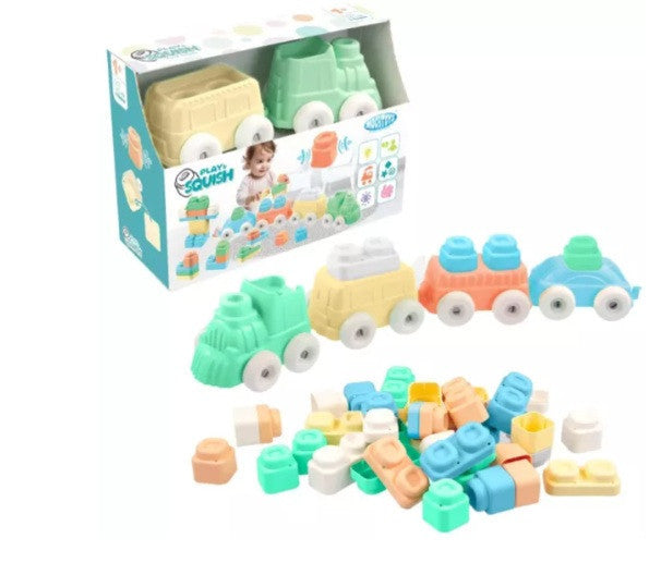 Soft squish train building blocks set with three toy trains and colorful pieces