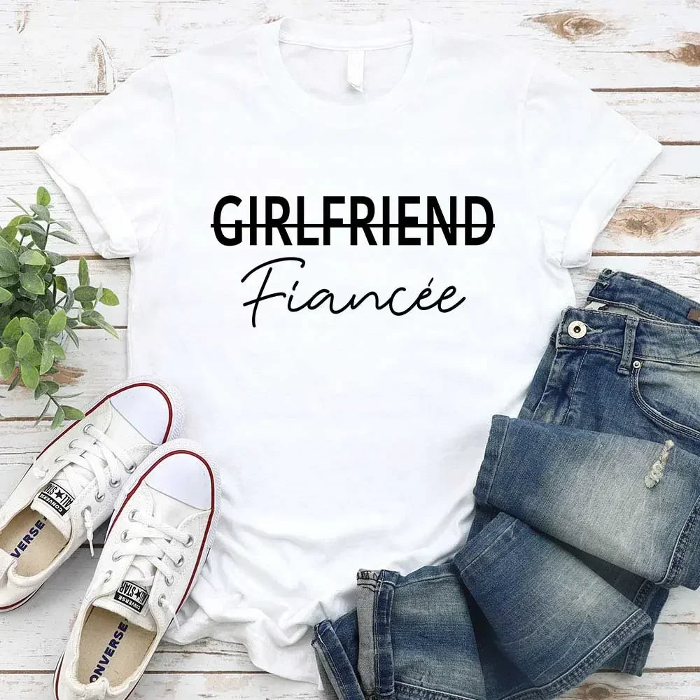 White girlfriend tee with crossed-out GIRLFRIEND and Fiancée script print