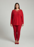 Crimson red lace-embellished knit tunic top with long sleeves and rounded neckline