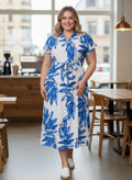 Blue and white leaf print midi shirt dress with short sleeves and tie waist