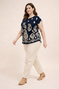 Navy button-shoulder top with white paisley border print, short sleeves
