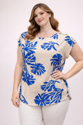 Beige button-shoulder top with blue tropical leaf print, short sleeves and crew neck