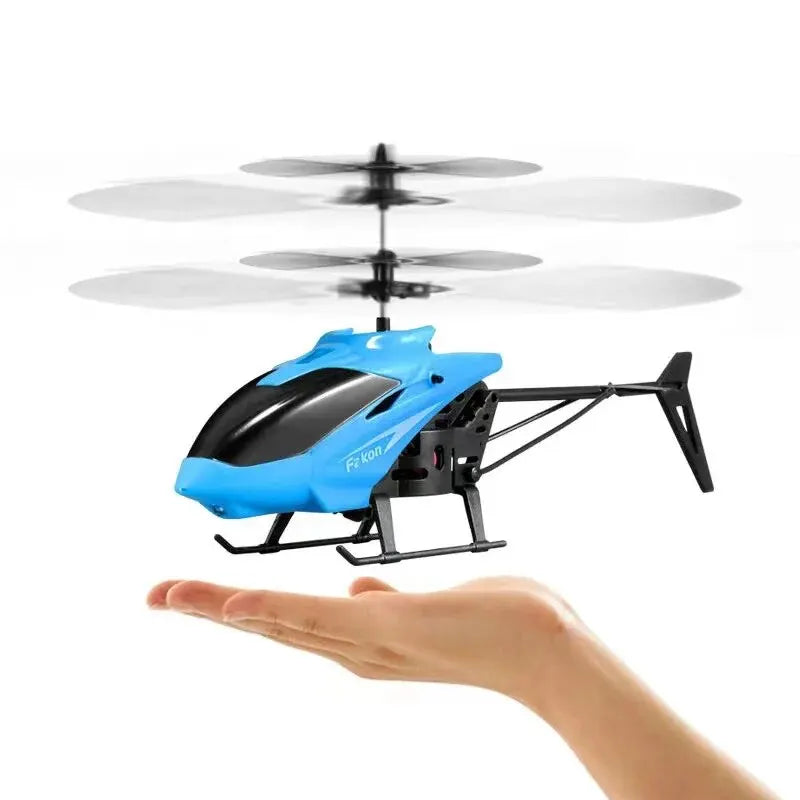 Blue and black gesture-control flying helicopter toy held by hand with spinning rotors
