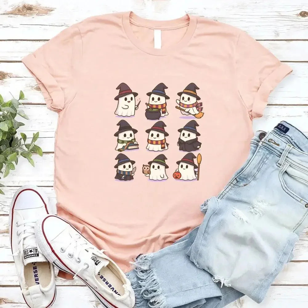 Light pink Halloween T-shirt with row of cute witch, ghost, and pumpkin icons