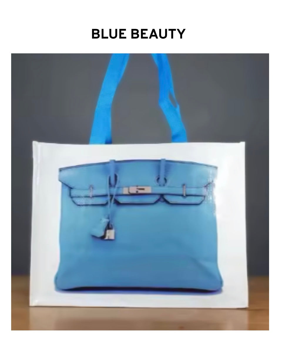 Blue reusable tote bag with two top handles and textured front panel