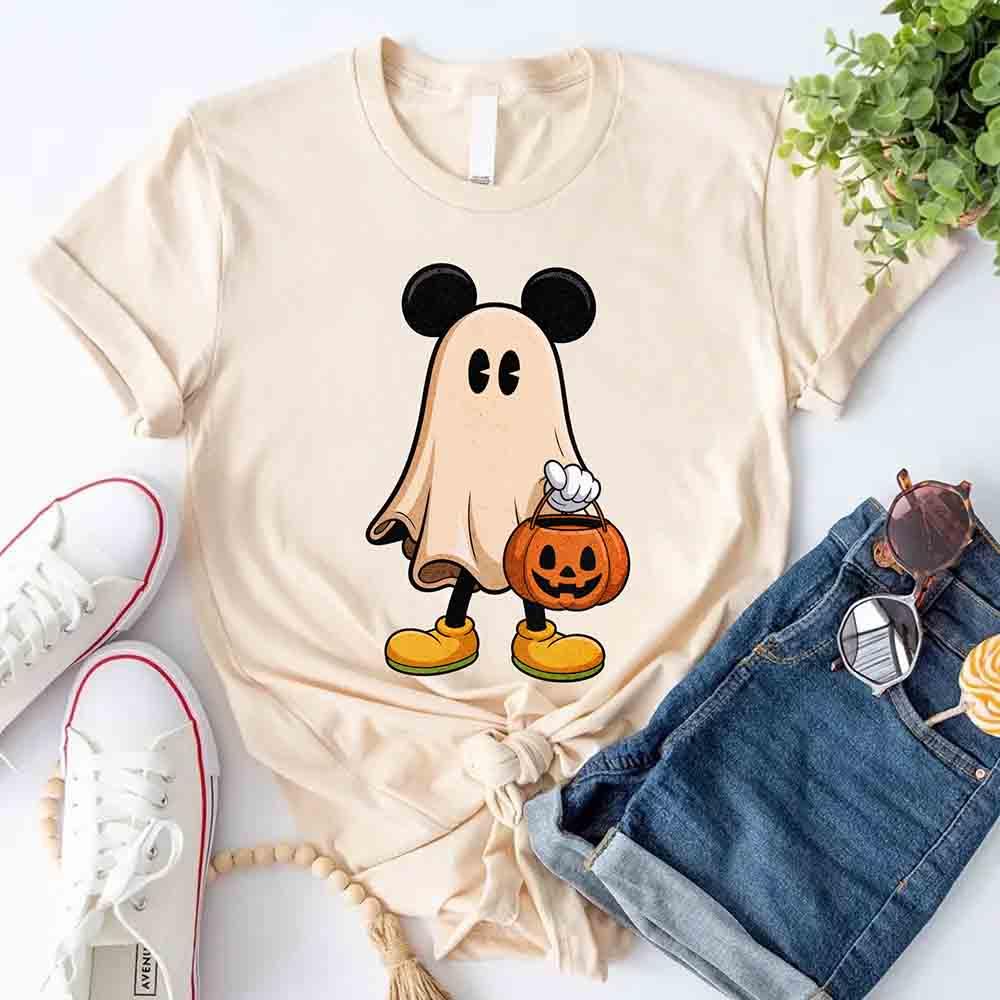 Cream Halloween ghost cartoon T-shirt with pumpkin bucket graphic at center