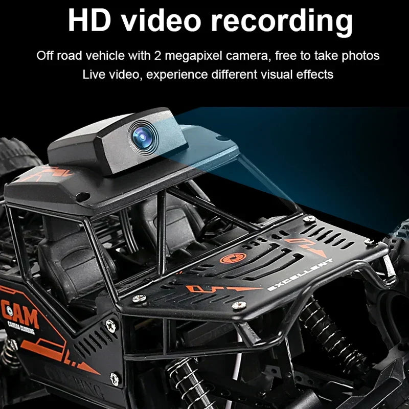 RC stunt SUV with HD camera on roof, black chassis with orange details and off-road tires