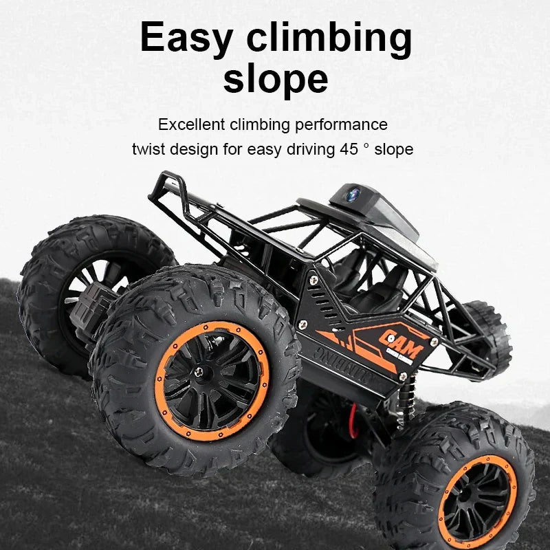 RC stunt SUV with front HD camera in climbing pose, orange-rim wheels and chunky off-road tires