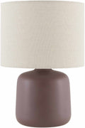 Ceramic table lamp with dark brown rounded base and light linen fabric drum shade