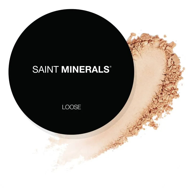 SAINT MINERALS Loose powder compact with medium tan powder swatch.