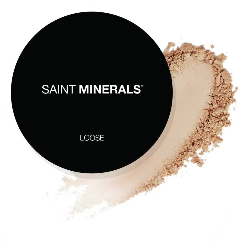 SAINT MINERALS Loose powder compact with bronze-tan powder swatch.