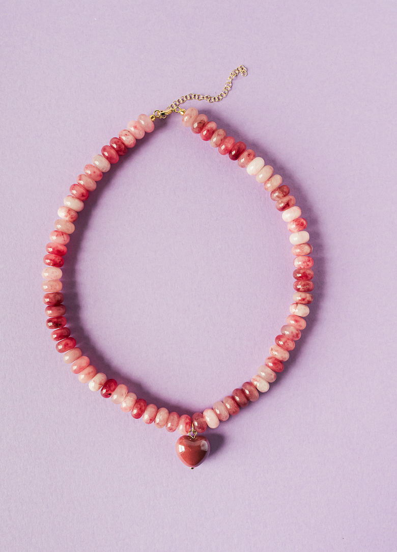 Pink and coral beaded necklace with heart pendant on gold-tone chain