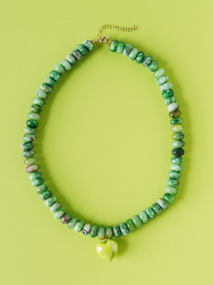 Green beaded necklace with apple-green heart charm on gold-tone chain