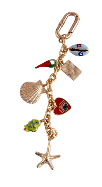 Gold-tone bag charm with starfish, seashell, fish, and crab charms on a chain