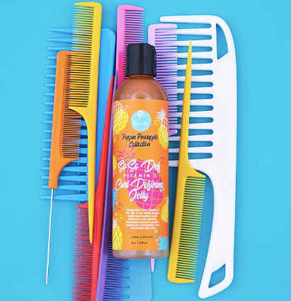 Vitamin C curl defining jelly bottle with dark pump and amber pineapple-colored liquid