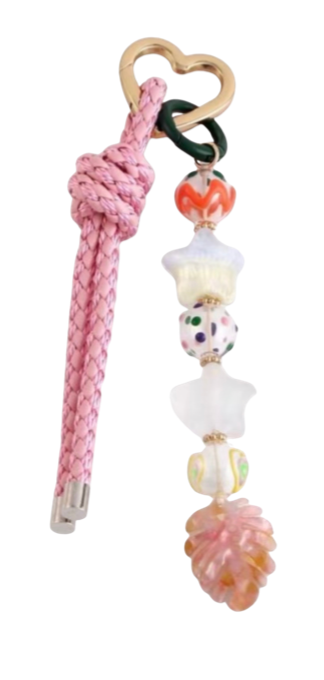 Pink braided bag charm with heart clasp and dangling white and multicolor charms