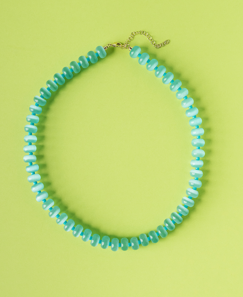 Aqua beaded necklace with gold-tone extender chain and curved bead strand