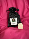 Wax melt set in black satin drawstring pouch with label and cream wax cube