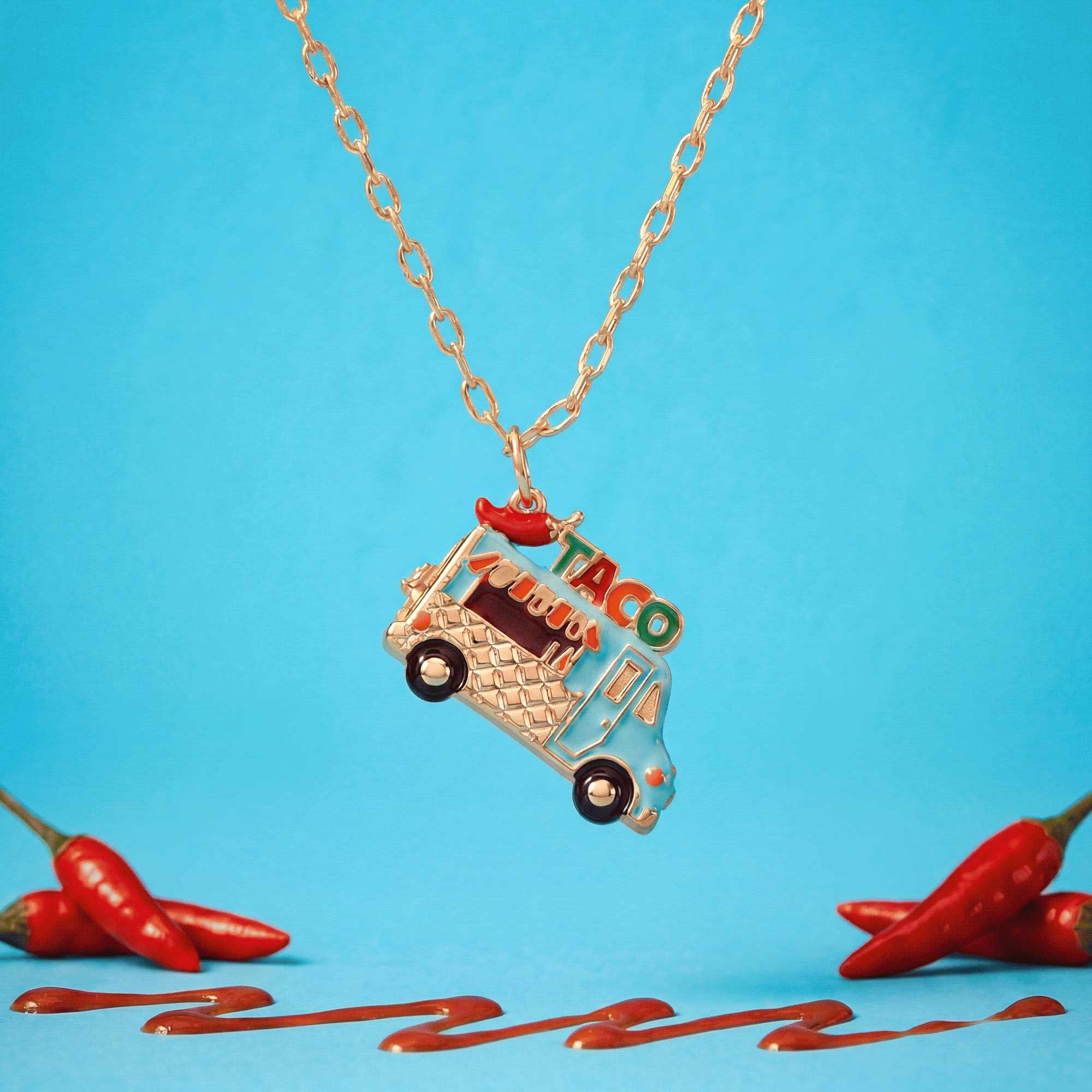 Gold taco truck locket necklace with taco truck charm and dangling mini bottle.