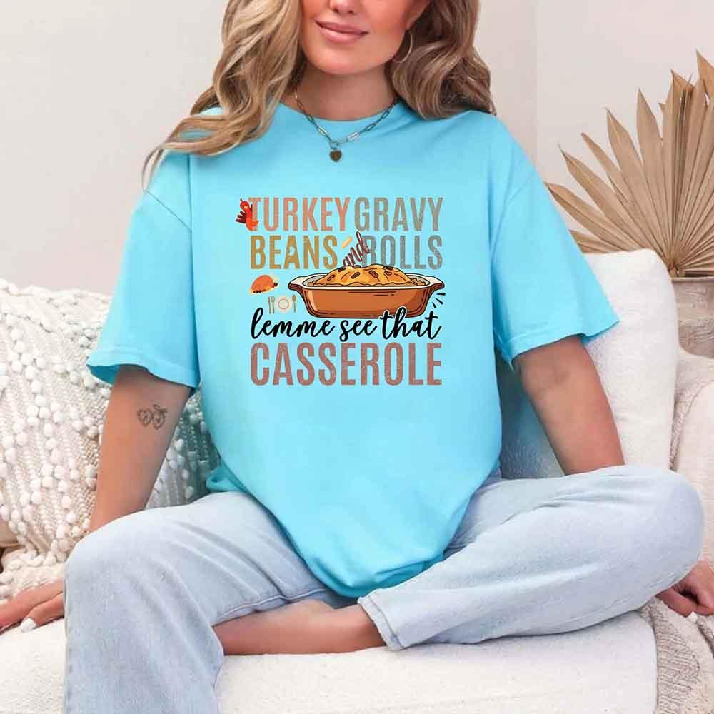 Light blue crewneck T-shirt with colorful turkey beans and casserole graphic