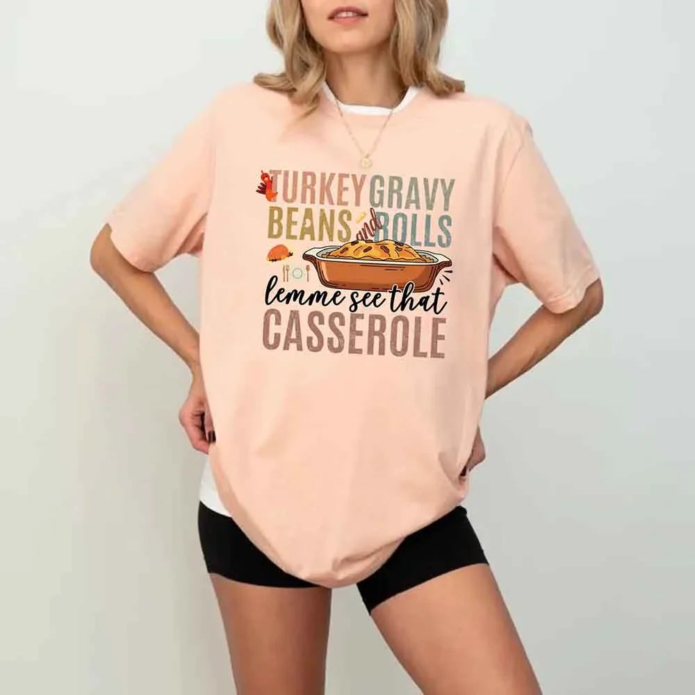 Peach crew-neck Thanksgiving graphic T-shirt with “casserole” text and dish artwork
