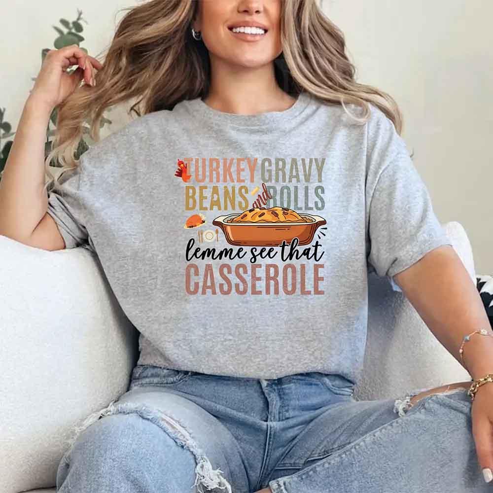 Grey crew-neck Thanksgiving graphic T-shirt with “casserole” slogan and tray illustration