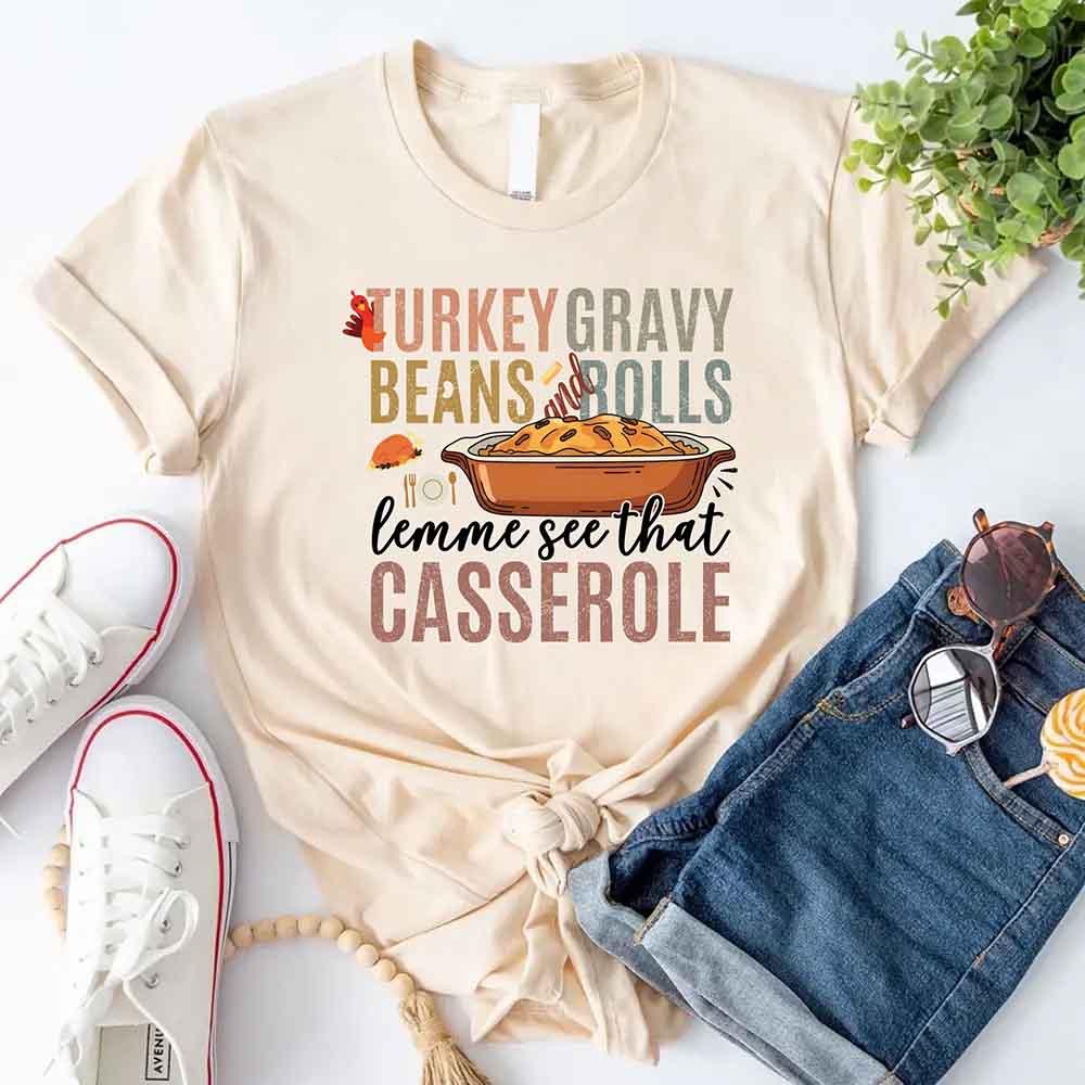 Cream crewneck T-shirt with turkey gravy beans and casserole graphic on front