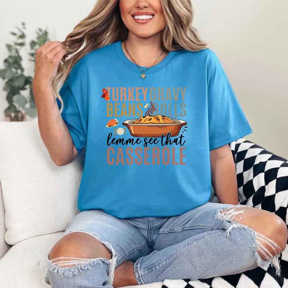 Blue crewneck T-shirt with “casserole” graphic and turkey beans motif