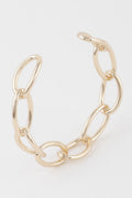 Gold link chain cuff bracelet with oval ring links and open oval clasp detail
