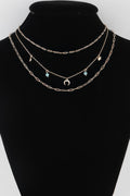 Layered link necklace with turquoise bead charms and small lucky pendants