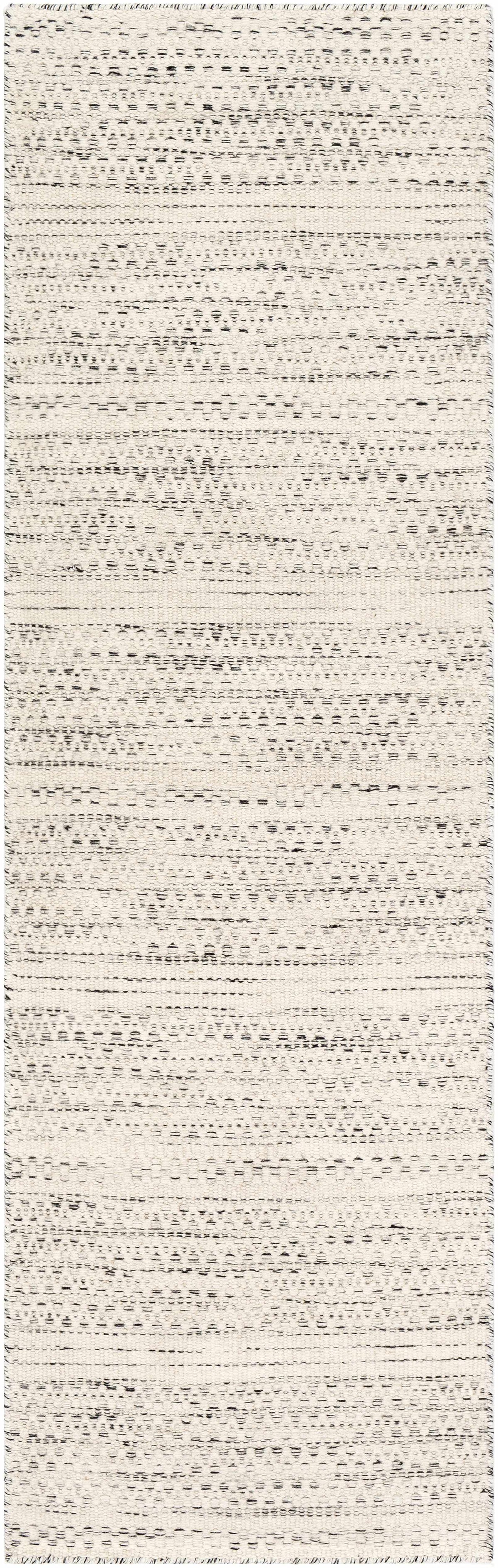 Cream and black woven area rug with horizontal dotted stripe pattern