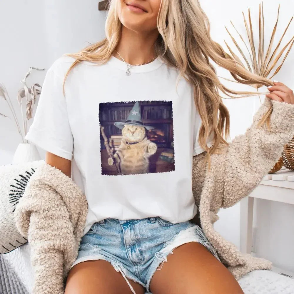 White cat wizard Halloween graphic T-shirt on model, short-sleeve crew neck