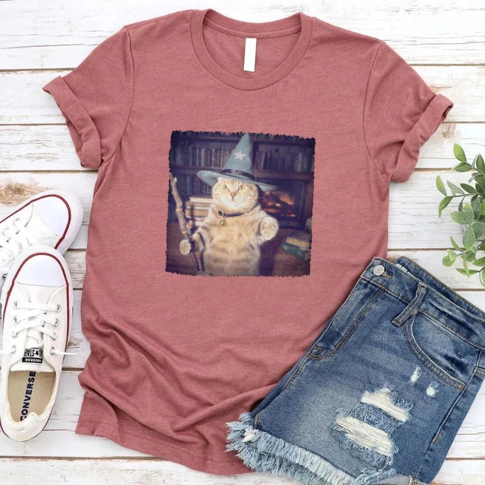 Dusty rose cat wizard graphic T-shirt with square illustrated feline print on front.