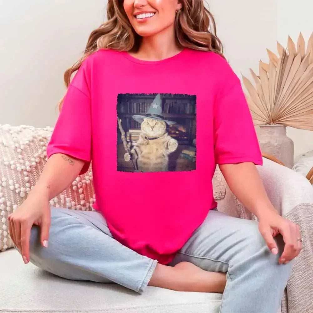 Hot pink Halloween cat wizard graphic T-shirt with a square illustrated cat print on front.