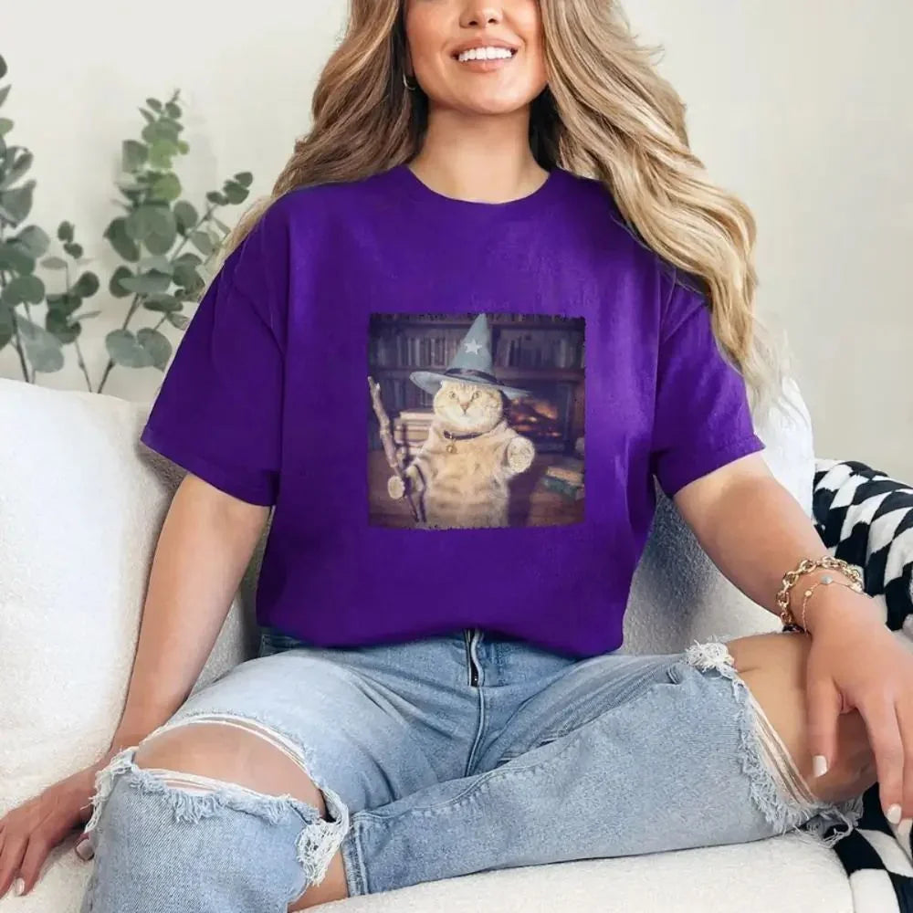 Purple cat wizard graphic tee worn with light blue jeans