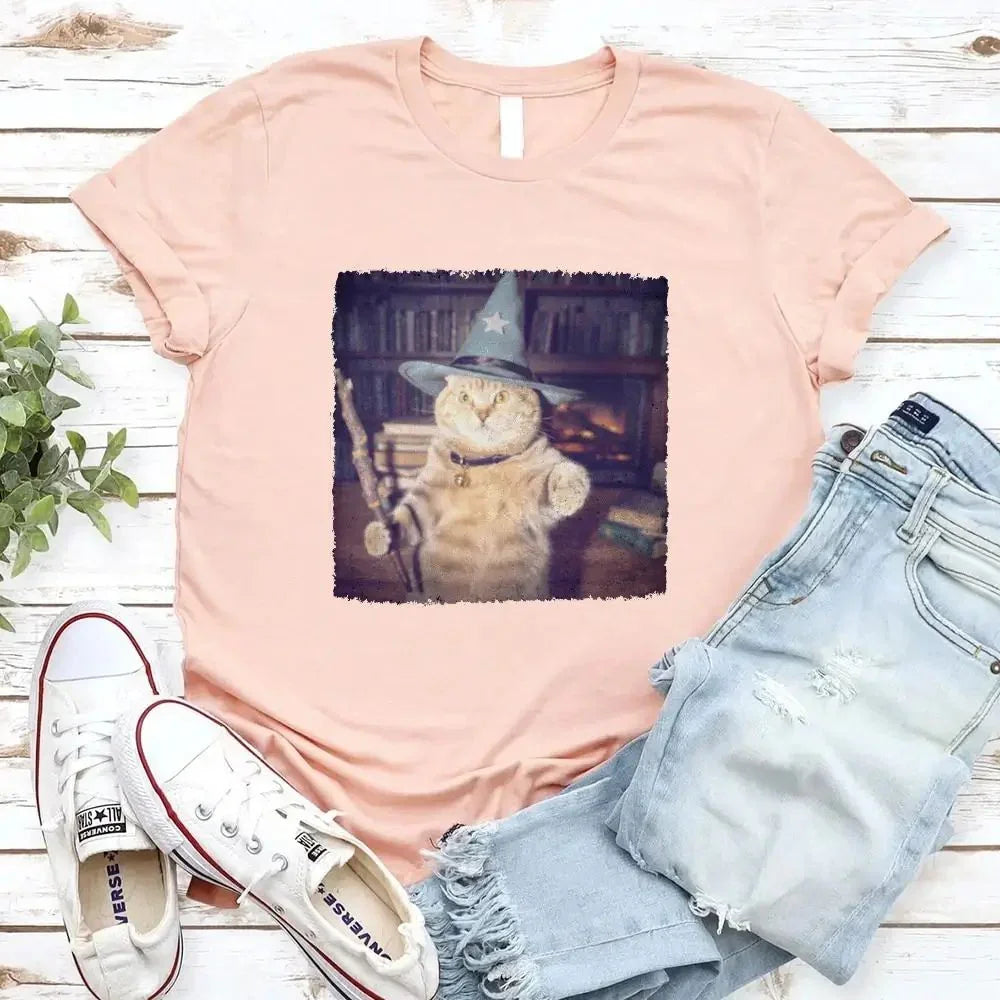 Peach cat wizard graphic T-shirt with a square illustrated feline print on the chest.