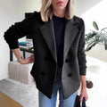 Black double-breasted lapel jacket with ribbed knit sleeves and four front buttons.