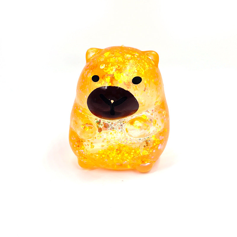 Orange capybara-shaped squishy candy stress toy, glittery translucent body with black face