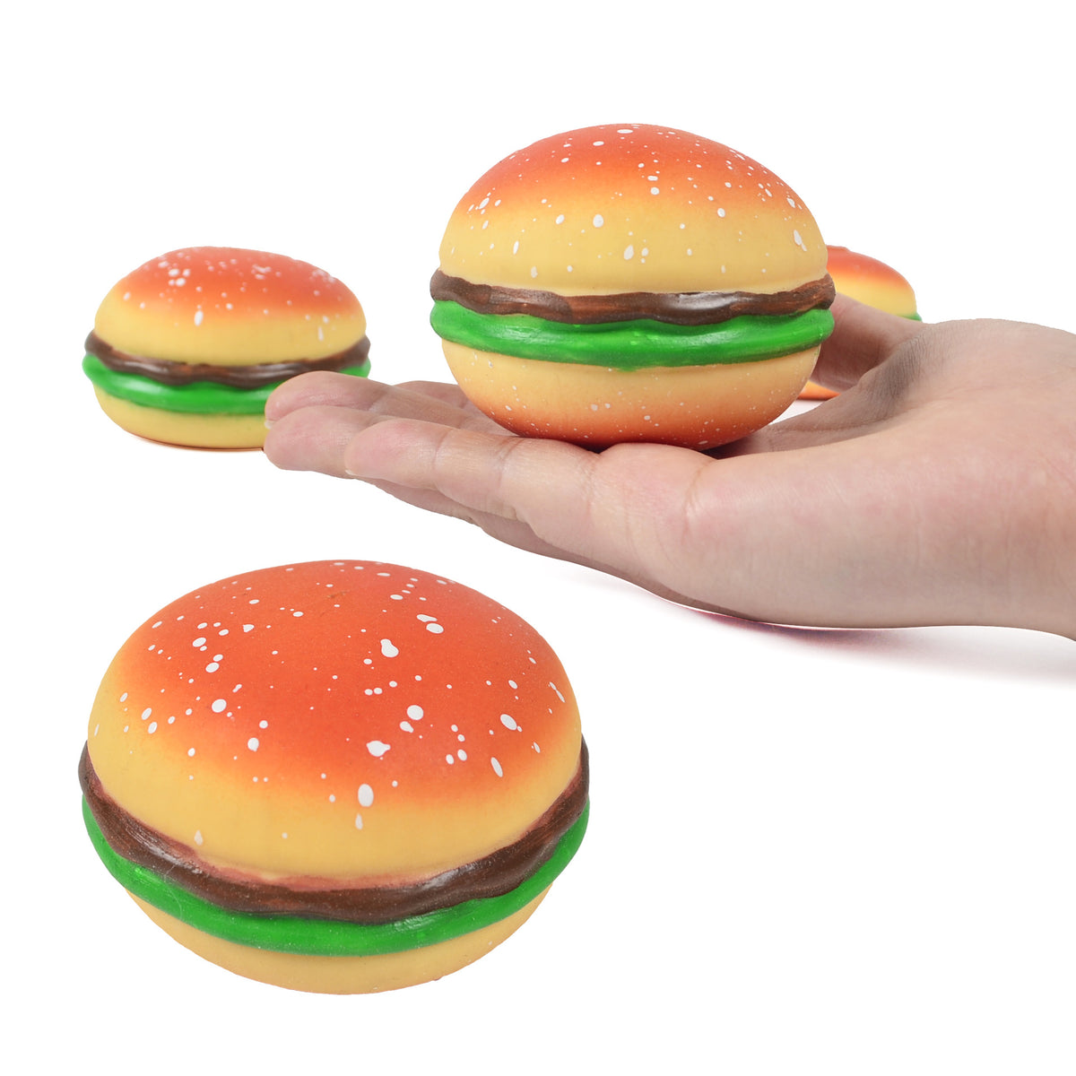 Set of burger squishy stress relief balls with orange bun, green lettuce, and brown patty