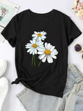 Black short-sleeve T-shirt with white daisy cartoon print and yellow centers.