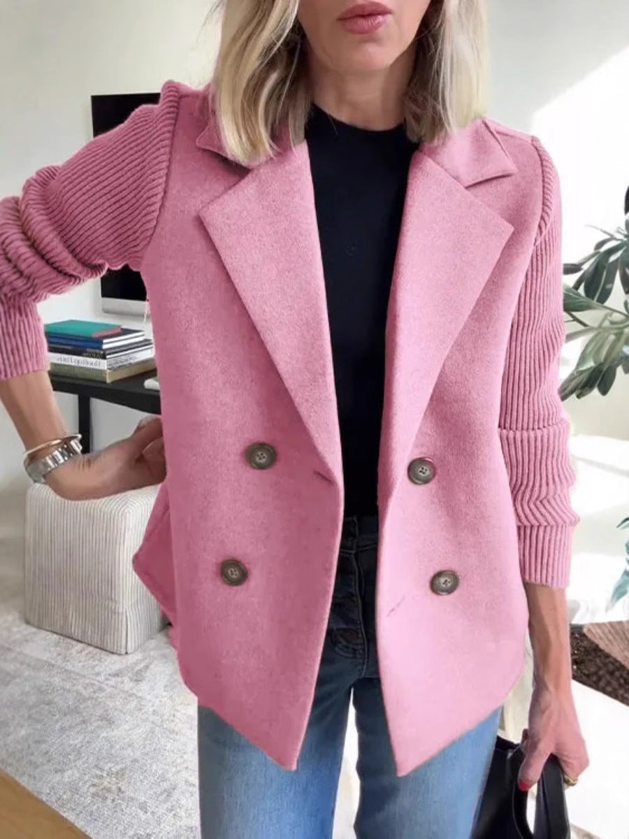 Pink double-breasted lapel jacket with ribbed knit sleeves and dark four-button front.